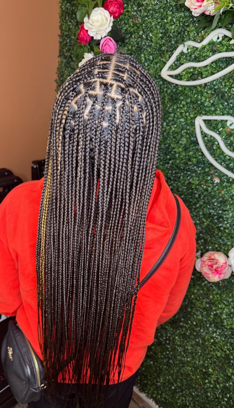 Mid-back knotless braids by Joyce Braids